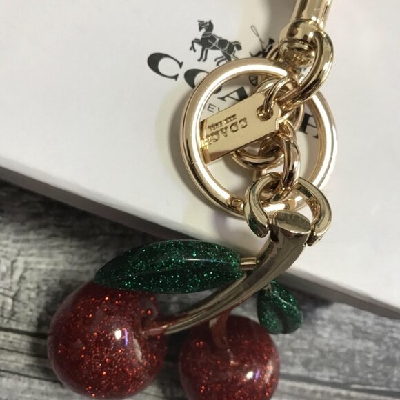 Coach Glitter Cherry Keychain with Gold and Green Accents - Picture 3 of 6